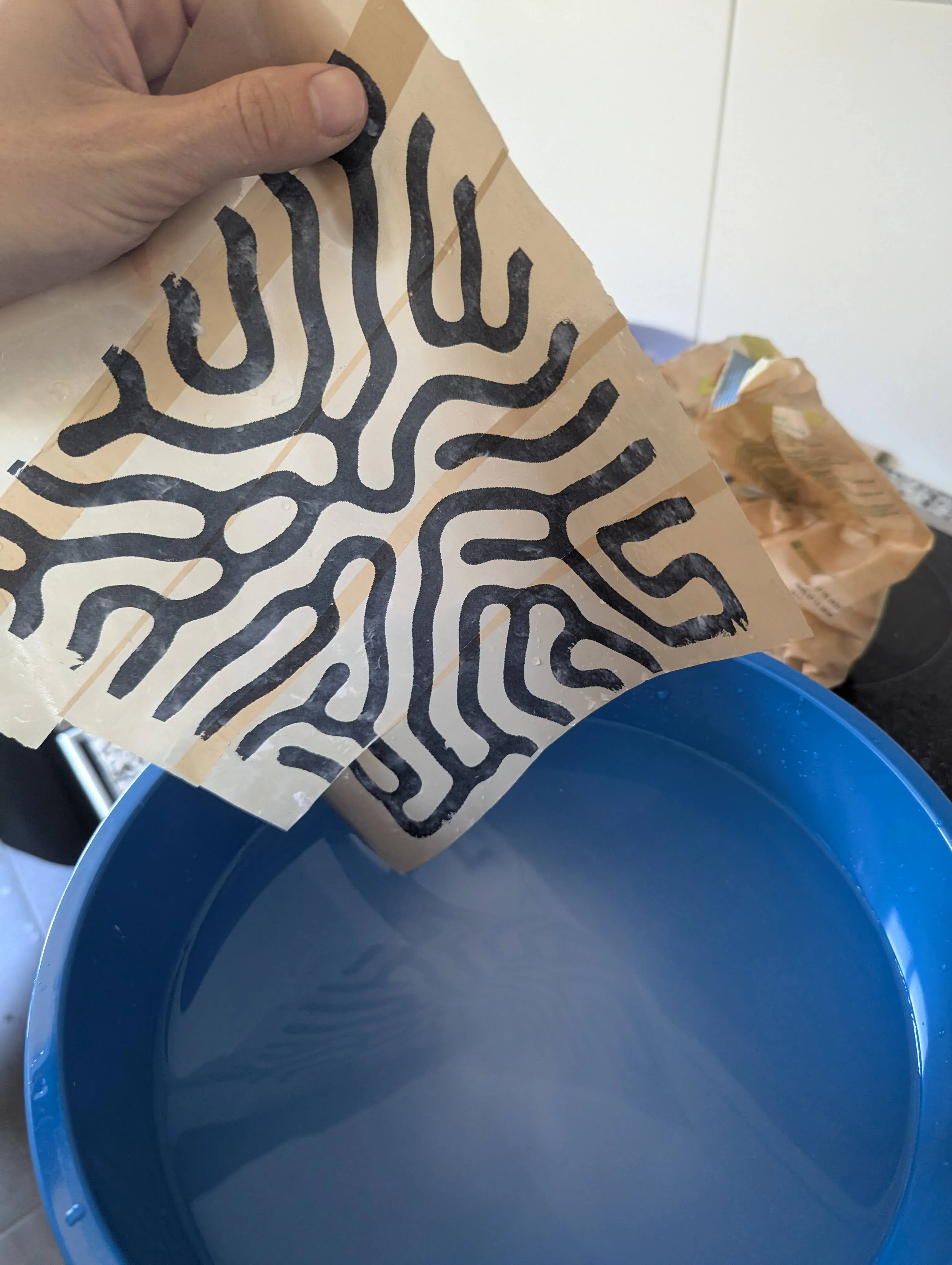printed paper on package tape. Already rubbed the non inked paper off
